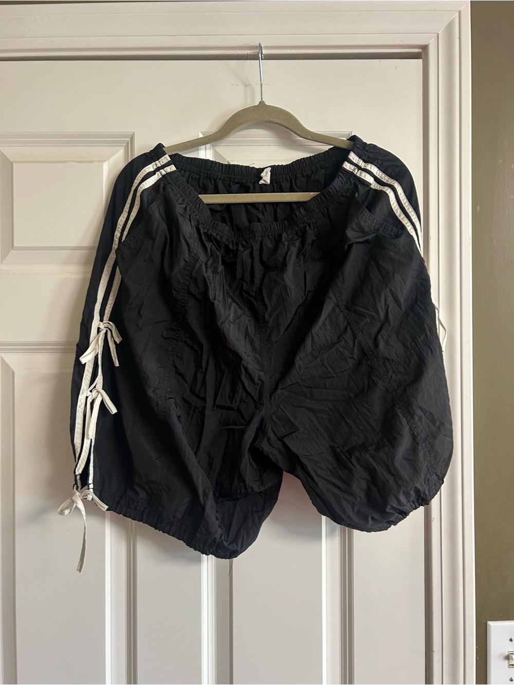 Black Athletic Shorts with White Side Stripes and Drawstring Ties